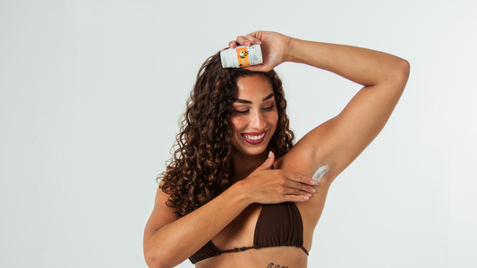 woman applying deodorant for body odor